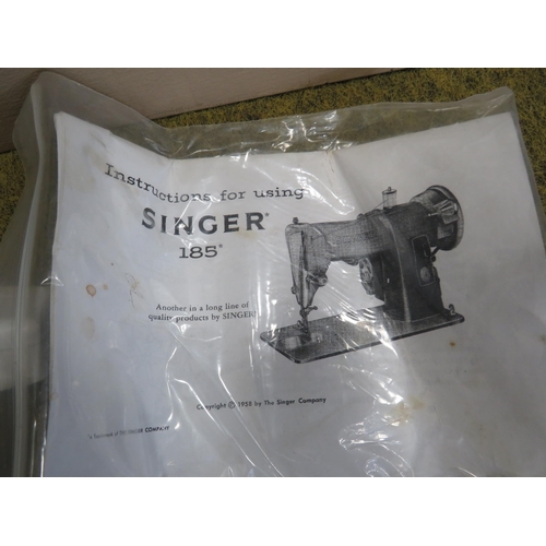 697 - Vintage Singer 185 sewing machine in case with instructions.