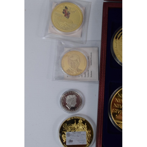 418A - Selection of Gold and Silver plated Cupro Nickel commemorative coins. Presentation box included. See... 