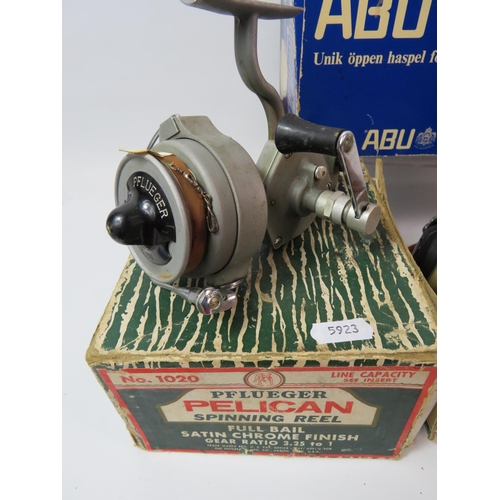 1076 - Abu 506, Mitchell 306, Pflueger Pelican spinning reel, all with original but tatty boxes plus a Mast... 