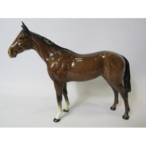 19 - Beswick Hunter in Brown Gloss Glaze. 8 inches tall. See photos