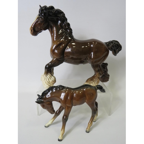 20 - Beswick Cantering Shire with round base stamp together with a Beswick Foal (glued repair to tail) se... 