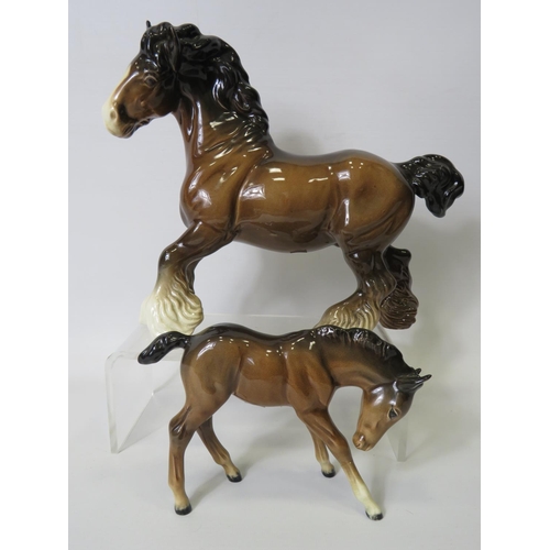 23 - Beswick Cantering Shire with round base stamp together with a Beswick Foal (glued repair to front le... 