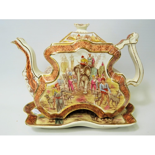 64 - Victorian Staffordshire Indian inspired transfer printed teapot with matching shaped tray,. Register... 