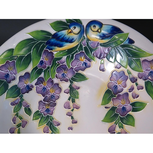 76 - Very pretty footed bowl by Blue Sky 2011 with tube lined decoration of Blue Birds and Hanging Wister... 