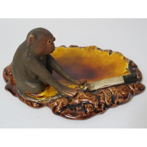 89 - Bretby Novelty ash tray showing a glass eyed Monkey and part smoked cigarette. Mould number 1825 pos... 