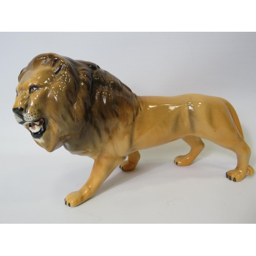 9 - Beswick figurine of an African Lion,  5 inches tall X 8.5 inches long. See photo