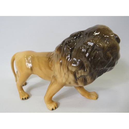 9 - Beswick figurine of an African Lion,  5 inches tall X 8.5 inches long. See photo