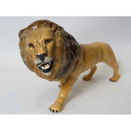 9 - Beswick figurine of an African Lion,  5 inches tall X 8.5 inches long. See photo