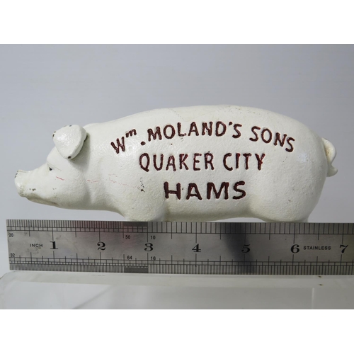 95 - Heavy cast Iron advertising money box as a pig. 7 inches long. See photos.