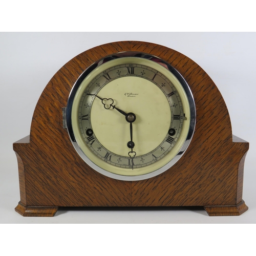 389 - G W Benson oak cased chiming mantle clock with enamel face in working condition.