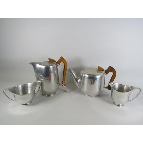 392 - Retro Piquot ware teaset, consisting of tea and coffee pots milk and sugar jug.