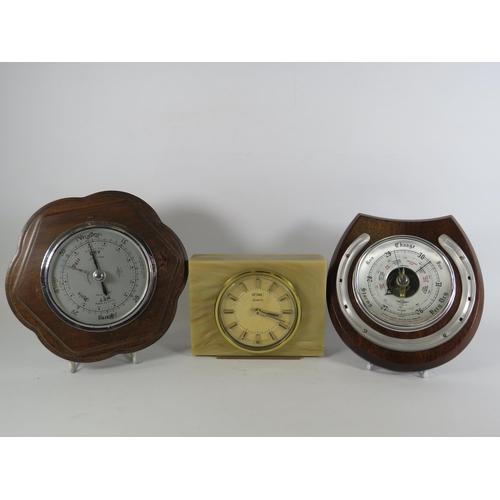 393 - 2 Vintage small wooden surround barometers and a Metamac mantle clock.