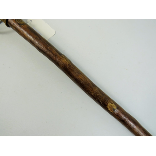 787 - Indian made swordstick. 36 inches long. Brass head handle, natural wood sheath. See photos.