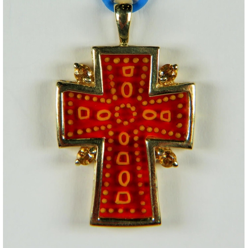 221A - 9ct Cross pendant set with cushion cut Citrenes. Measures 33mm long. 2.6g