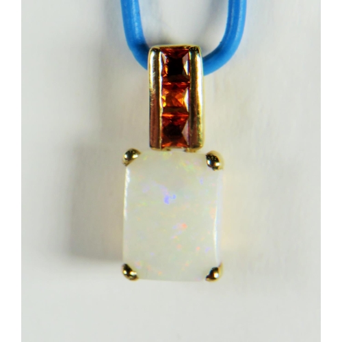 223A - 9ct Yellow Gold pendant set with an Oblong Opal and orange Sapphires. See photos.