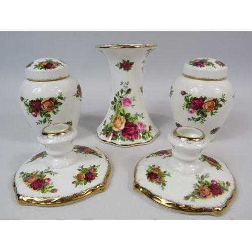 19 - A pair of Royal Albert Old Country Roses small candle sticks, 1 large candlestick & 2 Ginger jars.