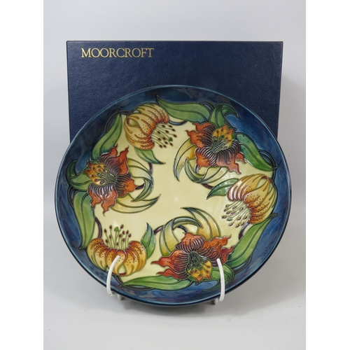 73 - Large Moorcroft Anna Lily pattern Bowl 25cm diameter 8cm deep and comes with the box.