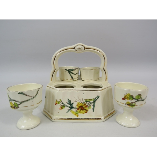 152 - Vintage ceramic 4 egg cup cruet set in a basket.