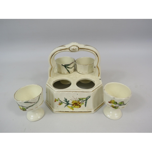 152 - Vintage ceramic 4 egg cup cruet set in a basket.