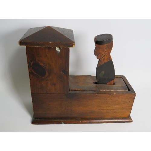 294 - Vintage wooden novelty money box as a sailor. Measures 8 inches tall X 10 inches long. See photos.