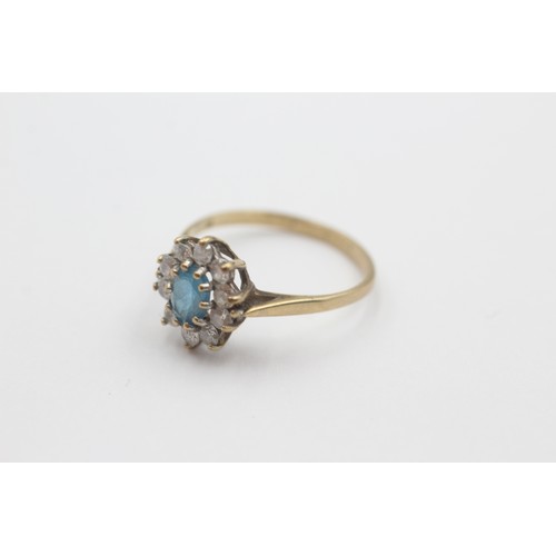 25 - 9ct gold blue topaz & clear gemstone cluster dress ring (1.7g)     798354
Ring Size 'M'