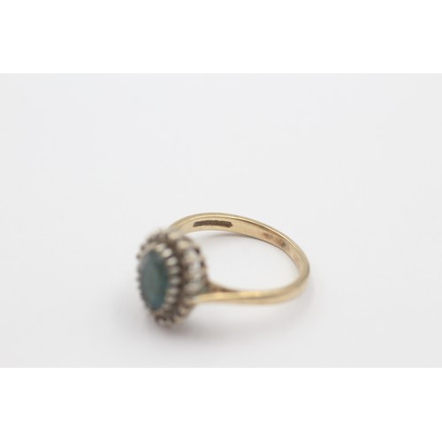 33 - 9ct gold vintage topaz & diamond halo dress ring (2.7g)     798321
Ring Size 'L'