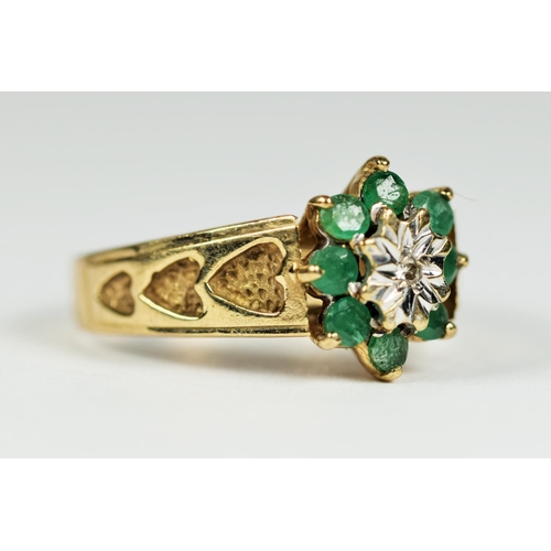 168 - 9ct Yellow Gold ring set with a Central Diamond surrounded by Eight Emeralds. Finger size 'L-5'   2.... 