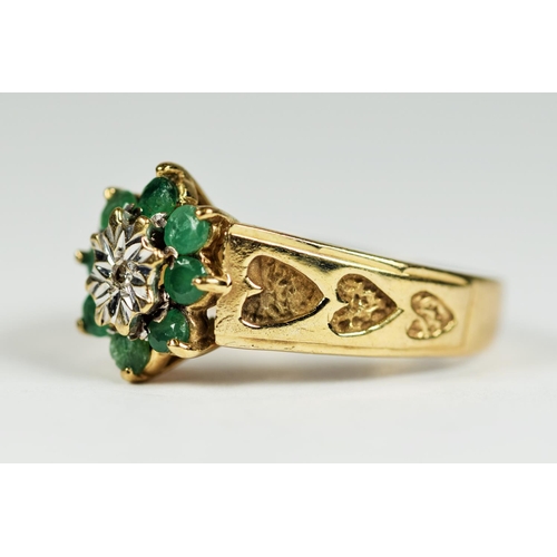 168 - 9ct Yellow Gold ring set with a Central Diamond surrounded by Eight Emeralds. Finger size 'L-5'   2.... 