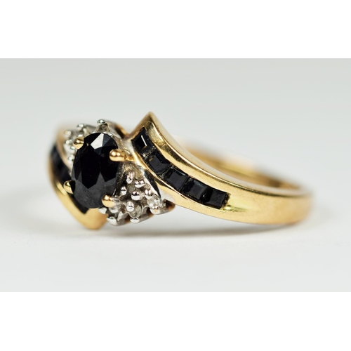 172 - 9ct Yellow Gold Ring set with multiple Sapphires interspersed with Melee Diamonds.   Finger size 'P-... 