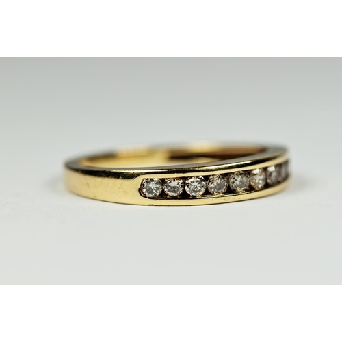 194 - 9ct Yellow Gold, 10 Diamond ring in channel setting.  Finger size 'l-5'  1.5g   0.025pts Diamonds.