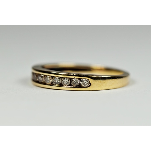 194 - 9ct Yellow Gold, 10 Diamond ring in channel setting.  Finger size 'l-5'  1.5g   0.025pts Diamonds.