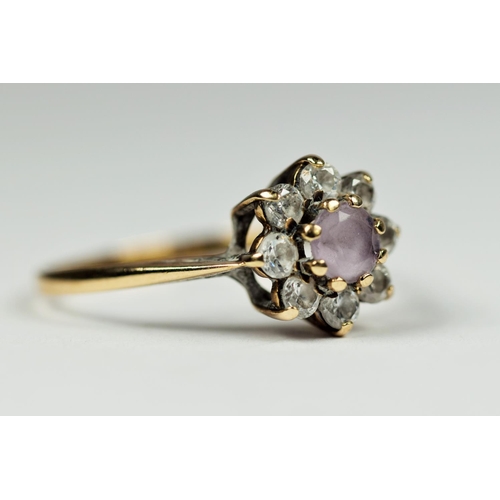 197 - 9ct Yellow Gold flower pattern ring set with pink CZ.   Finger size 'L-5'  1.4g