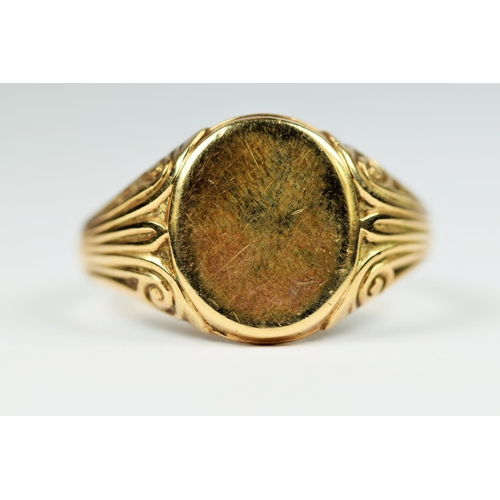 198 - Large 9ct Gold Gent's Signet ring, Scrolled decoration to shoulders with unmarked face.  Good clear ... 