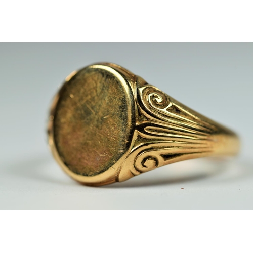 198 - Large 9ct Gold Gent's Signet ring, Scrolled decoration to shoulders with unmarked face.  Good clear ... 