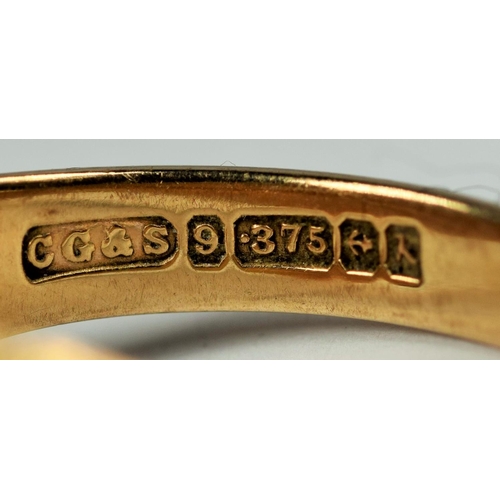 198 - Large 9ct Gold Gent's Signet ring, Scrolled decoration to shoulders with unmarked face.  Good clear ... 