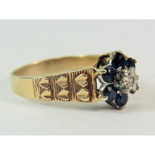 208 - 9ct Yellow Gold ring set with Small 150th pt Diamond and Six 10mm Sapphires. Finger size  'P-5'  3.7... 