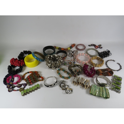 260 - Job lot of costume jewellery bracelets including a sterling silver snake bracelet and some designer ... 