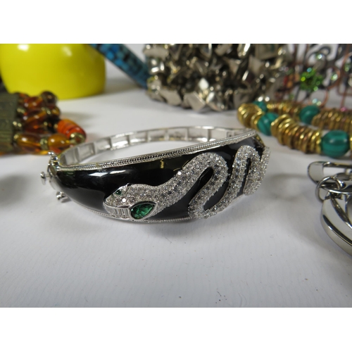 260 - Job lot of costume jewellery bracelets including a sterling silver snake bracelet and some designer ... 