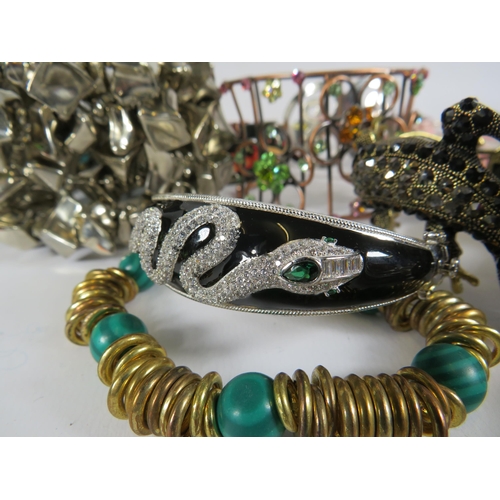 260 - Job lot of costume jewellery bracelets including a sterling silver snake bracelet and some designer ... 