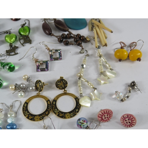 267 - Large selection of earrings many of which are sterling silver.