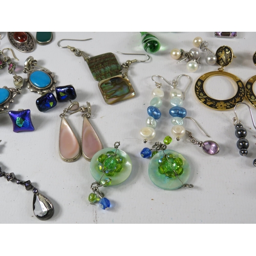 267 - Large selection of earrings many of which are sterling silver.