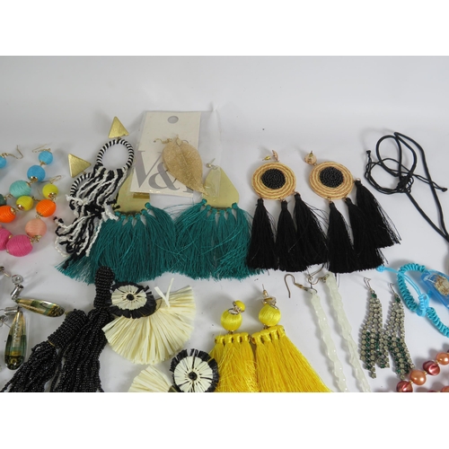 271 - Selection of statement earrings and beadded necklaces.