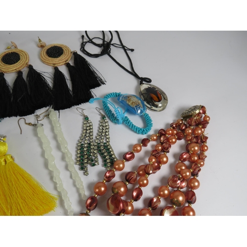 271 - Selection of statement earrings and beadded necklaces.