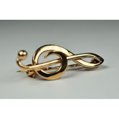 223 - 9ct Yellow gold brooch as a Musical notation.  35mm long     2.9g