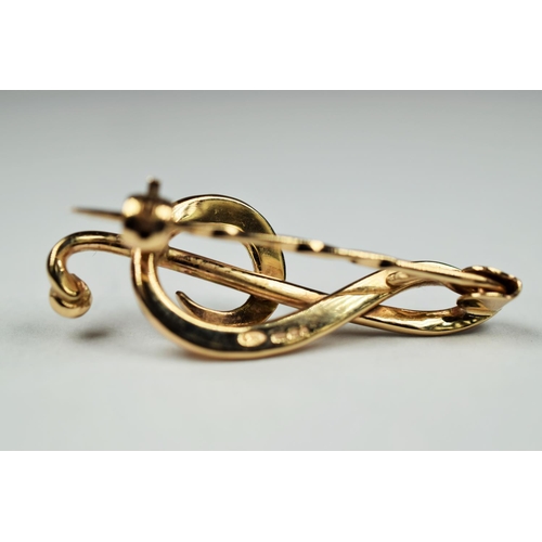 223 - 9ct Yellow gold brooch as a Musical notation.  35mm long     2.9g