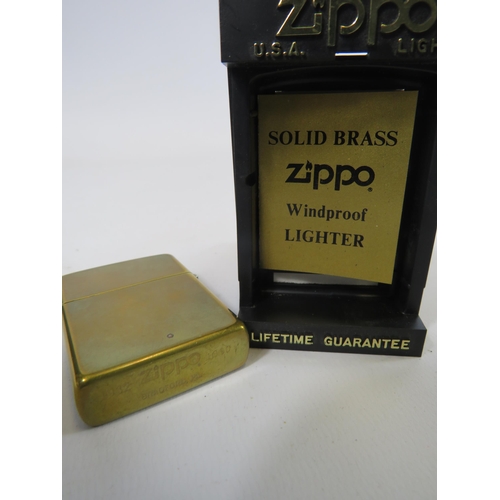 289 - Solid brass Zippo lighter with box.