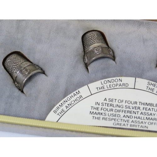 298 - A set of 4 thimbles in sterling silver featuring the 4 different assay marks used.