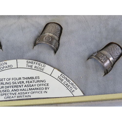 298 - A set of 4 thimbles in sterling silver featuring the 4 different assay marks used.