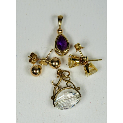 308 - Two pairs of 9ct Gold Earrings plus a 9ct pendant and clear stone set spinning fob.