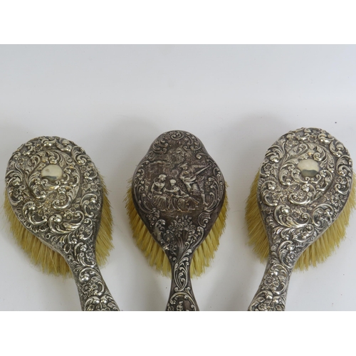 324 - 4 Sterling silver backed dressing table brushes all with hallmarks for Birmingham.